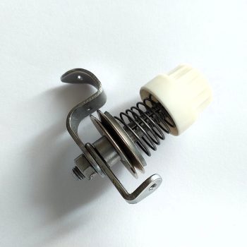 Textima fedőző szálfeszítő egység